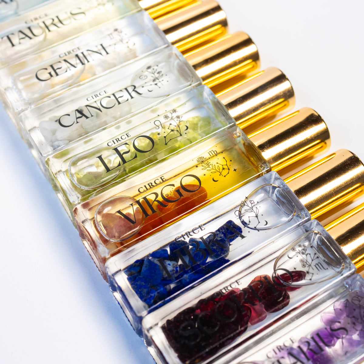 Zodiac gemstone-infused roll-on perfume oil bottles
