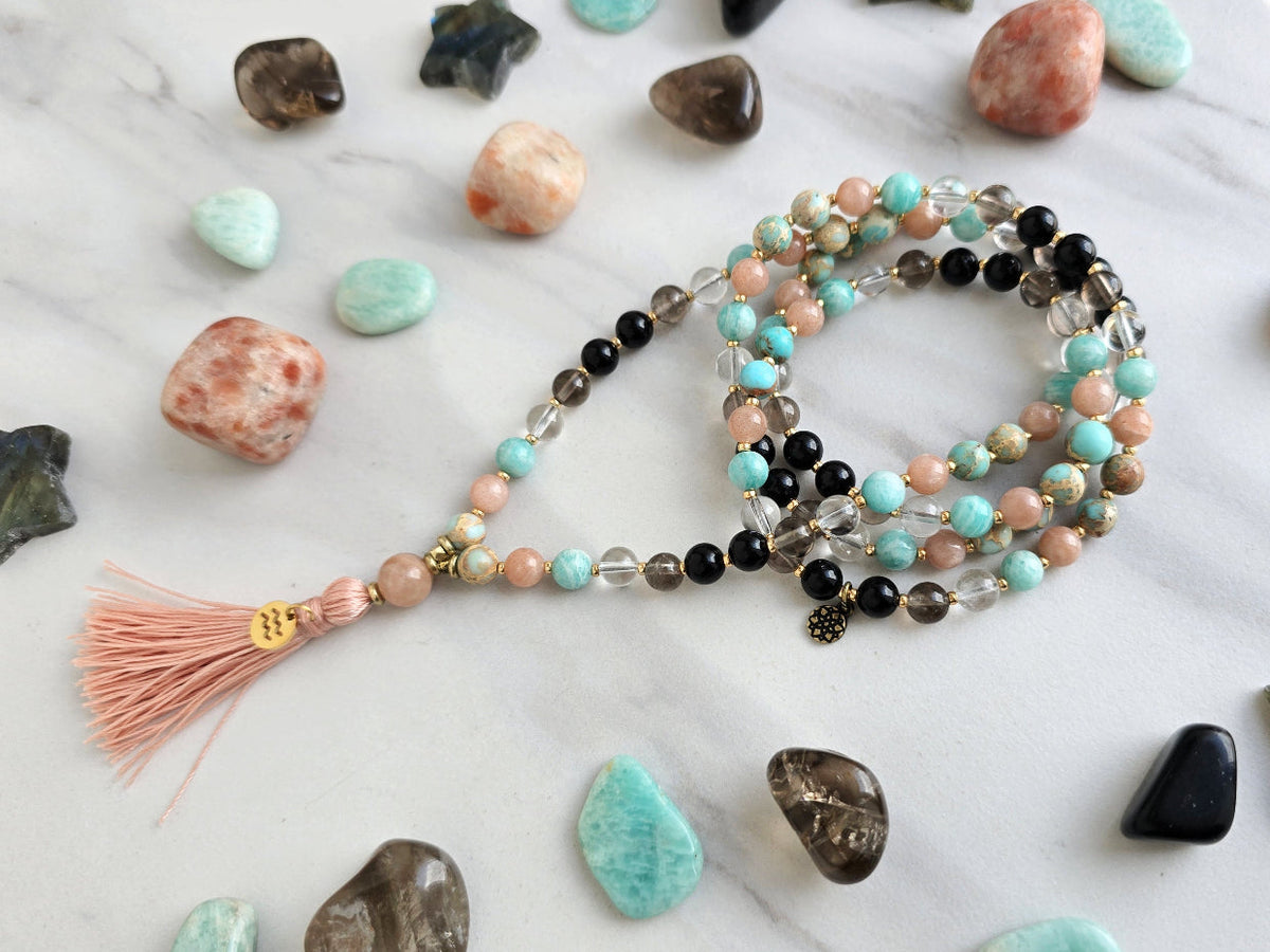 Aquarius zodiac mala necklace with sea sediment jasper and sunstone beads, Aquarius charm and tassel, view 5