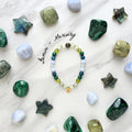 Gemini zodiac gemstone stretch bracelet with prehnite and peridot beads and Gemini charm