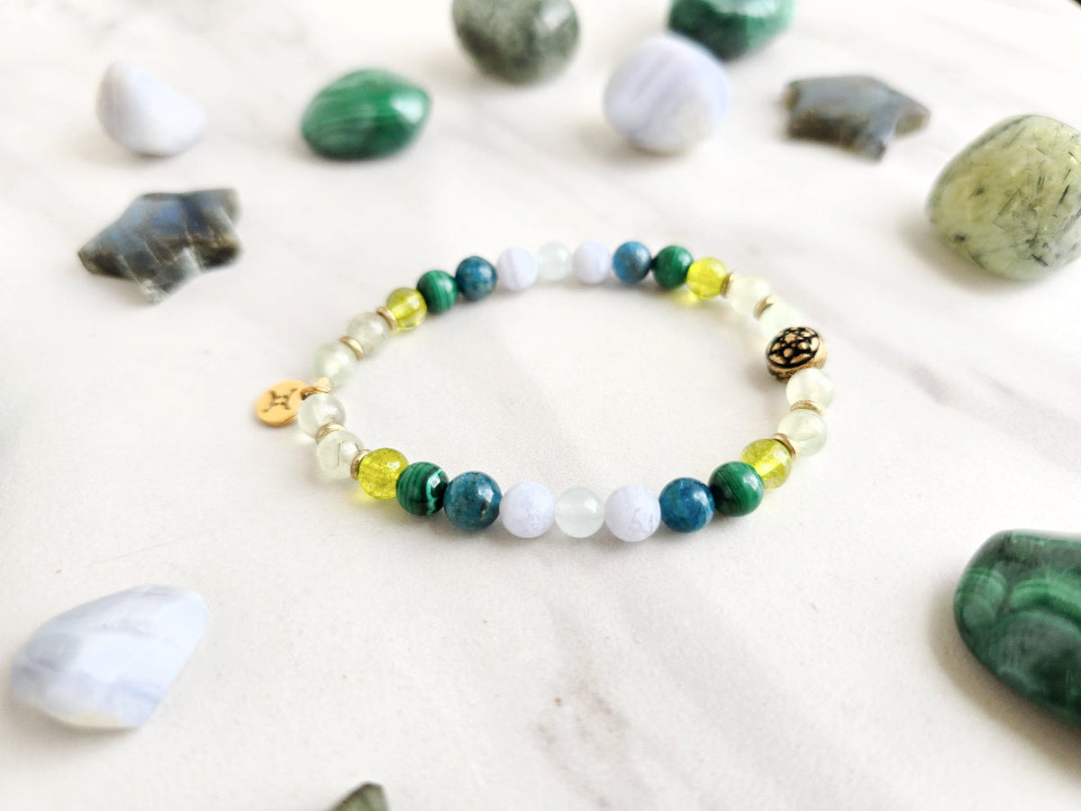 Gemini zodiac gemstone stretch bracelet with prehnite and peridot beads and Gemini charm, view 3