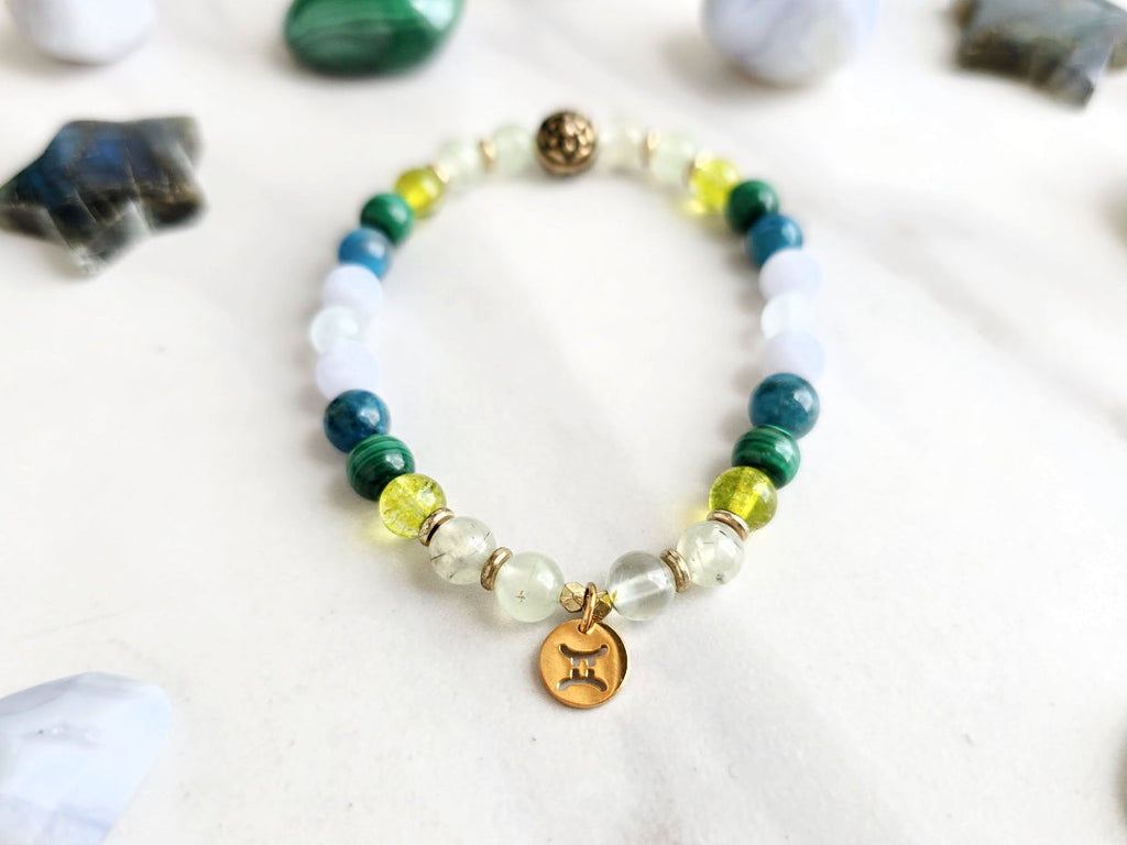 Gemini zodiac gemstone stretch bracelet with prehnite and peridot beads and Gemini charm, view 2