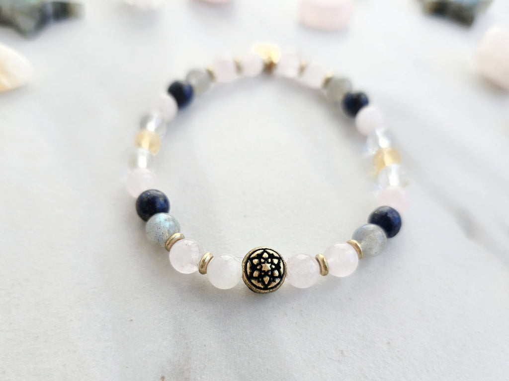 Libra zodiac gemstone stretch bracelet with lapis lazuli and kunzite beads and Libra charm, view 3