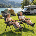 Two folding zero gravity lounge chairs with cup holder trays