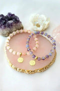 Rose quartz bead bracelet with gold-plated lotus flower charm