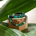 Malachite and black onyx bracelet set with open-hand charm